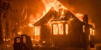 A house on fire at night