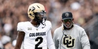 ORLANDO, FL - SEPTEMBER 28: Quarterback Shedeur Sanders #2 talk with Head Coach Deion Sanders of the Colorado Buffaloes prior to the game against the UCF Knights at FBC Mortgage Stadium on September 28, 2024 in Orlando, Florida. The Buffaloes defeated the Knights 48-21.(Photo by Don Juan Moore/Getty Images)