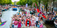 Boats on the Amstel river during Pride.