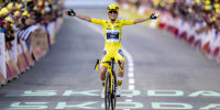 Pauline Ferrand-Prevot crosses the finish line on a bicycle