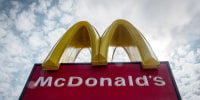 The logo of the fast food restaurant McDonald's is displayed outside a branch of the restaurant