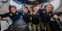 From left, NASA’s SpaceX Crew-10 members JAXA astronaut Takuya Onishi, NASA astronauts Anne McClain and Nichole Ayers, and Roscosmos cosmonaut Kirill Peskov pose for a portrait inside the SpaceX Dragon spacecraft that will return them back to Earth.