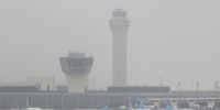 Image: Fog covers planes and control towers at Newark Liberty International Airport in Newark, N.J.