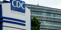 CDC headquarters exterior, bullet holes can be seen in windows in the distance