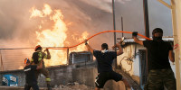 Greece Wildfires firefighter flame