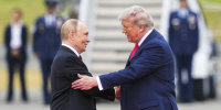 President Donald Trump greets Russia's President Vladimir Putin 