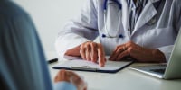 A doctor talks with a patient.