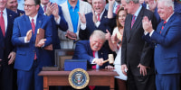 President Donald Trump pounds a gavel presented to him by House Speaker Mike Johnson