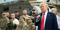 President Donald Trump speaks while visiting federal troops at the U.S. Park Police Anacostia operations facility in Washington, D.C., on Aug. 21, 2025. 