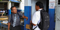Schools enforce order and discipline" regulations in San Salvador