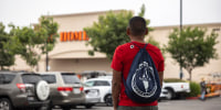 A day laborer waits in the parking lot of a Home Depot as federal immigration conducts raids in Los Angeles on June 20, 2025.   