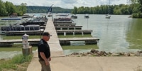 skid marks that were left on a sidewalk when a woman drove a golf cart into Atwood Lake