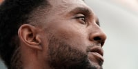 A close up photo of Brandon Scott's face as he speaks