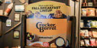 A cracker barrel menu sits on a shelf