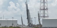 Three sounding rockets for the TOMEX+ mission are raised vertical on their launch pads 