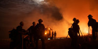 Firefighters battle the Lee Fire in Colorado on Friday.