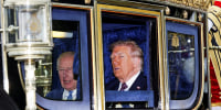 Donald Trump next to King Charles inside of a carriage