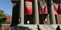Banners hang from the side of Memorial Church on the first day of classes at Harvard University.