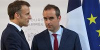 France's President Emmanuel Macron speaks with France's Minister of Armed Forces Sebastien Lecornu in Paris on July 13, 2025.