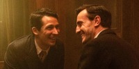 From left, Josh O'Connor and Paul Mescal laugh together, facing each other