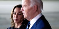 Kamala Harris, left, looks at Joe Biden as they stand next to each other