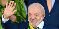 Luiz Inacio Lula da Silva smiles as he waves