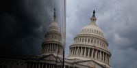 Storm clouds hover over the U.S. Capitol in July 2025.