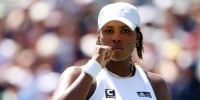 Taylor Townsend in a white cap, looking ahead.