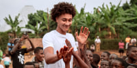 Nate Ament plays at a basketball camp in Rwanda during a trip in August.