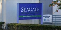 The exterior blue sign for Seagate Nursing and Rehabilitation Center