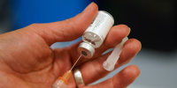 Sterile water is prepared for a one dose bottle of measles, mumps and rubella virus vaccine