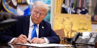 President Donald Trump signs an executive order in the Oval Office on Sept. 19, 2025 ,establishing the “Trump Gold Card” and introducing a $100,000 fee for H-1B visas. 