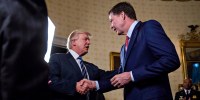 U.S. President Donald Trump shakes hands with James Comey, former director of the FBI in the White House.