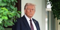 Donald Trump stands outside