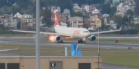 A Swiss International Air Lines plane briefly spits out flames during an aborted departure from Boston Logan International Airport on Tuesday, Sept. 16, 2025.