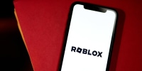 Roblox logo on phone screen