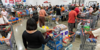 Shoppers wait to check out inside a Costco store