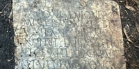 This photo provided by Tulane University classical archeologist Susann Lusnia shows a Latin inscription on the 1,900-year-old grave marker of a Roman sailor named Sextus Congenius Verus, discovered in a New Orleans backyard.