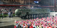 A picture released from North Korea's official Korean Central News Agency (KCNA) on October 11, 2025 shows a new intercontinental ballistic missile (ICBM) paraded through the streets