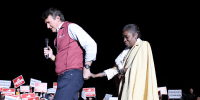 Glenn Youngkin leads Winsome Sears on stage