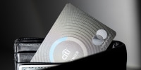 A Citi Mastercard credit card inside of a wallet peeking out