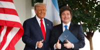 President Donald Trump greets Argentine President Javier Milei at the White House on Oct. 14, 2025.