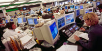 Traders at computer terminals in an office of Goldman Sachs in 1999.