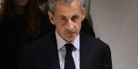 Former French President Nicolas Sarkozy leaves after a Paris court sentenced him to 5 years after finding him guilty of criminal conspiracy in an alleged scheme to finance his 2007 campaign with funds from Libya on Thursday, Sept. 25, 2025 in Paris.
