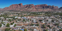 An aerial view of mountain tops and homes