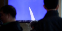 A tv screen shows a missile firing