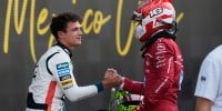 McLaren driver Lando Norris of Britain, left, the pole position winner, is congratulated by Ferrari driver Charles Leclerc of Monaco, who qualified second, during the qualifying session for Formula One Mexico Grand Prix auto race at the Hermanos Rodriguez race track in Mexico City, Saturday, Oct. 25, 2025.