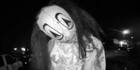 Individual in a clown mask caught  on Ring video.