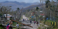 Residents walk through Lacovia Tombstone, Jamaica, in the aftermath of Hurricane Melissa, Wednesday, Oct. 29, 2025. 