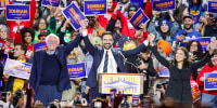 New York City mayoral candidate Zohran Mamdani holds hands with U.S. Senator Bernie Sanders and Rep. Alexandria Ocasio-Cortez.